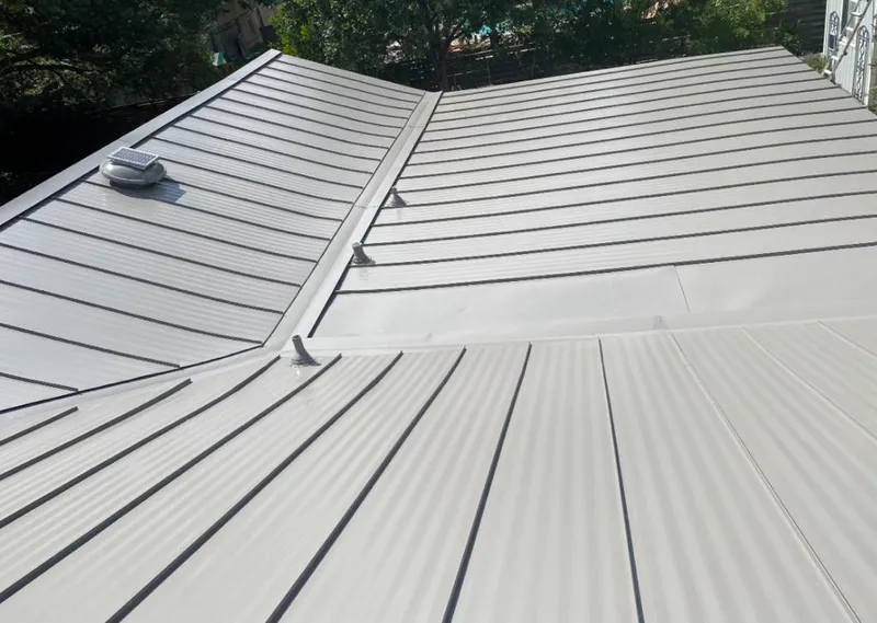 Solar attic fan installed on a metal roof for Roof Ventilation in White Plains